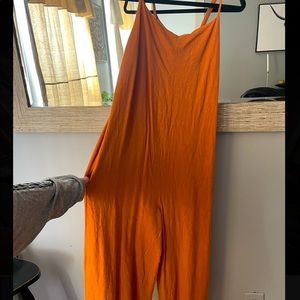 Orange native one jumpsuit, tags says large fit is a medium